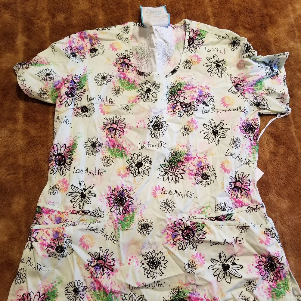 4 scrub tops. Never worn